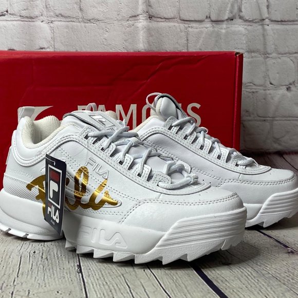 white and gold fila shoes